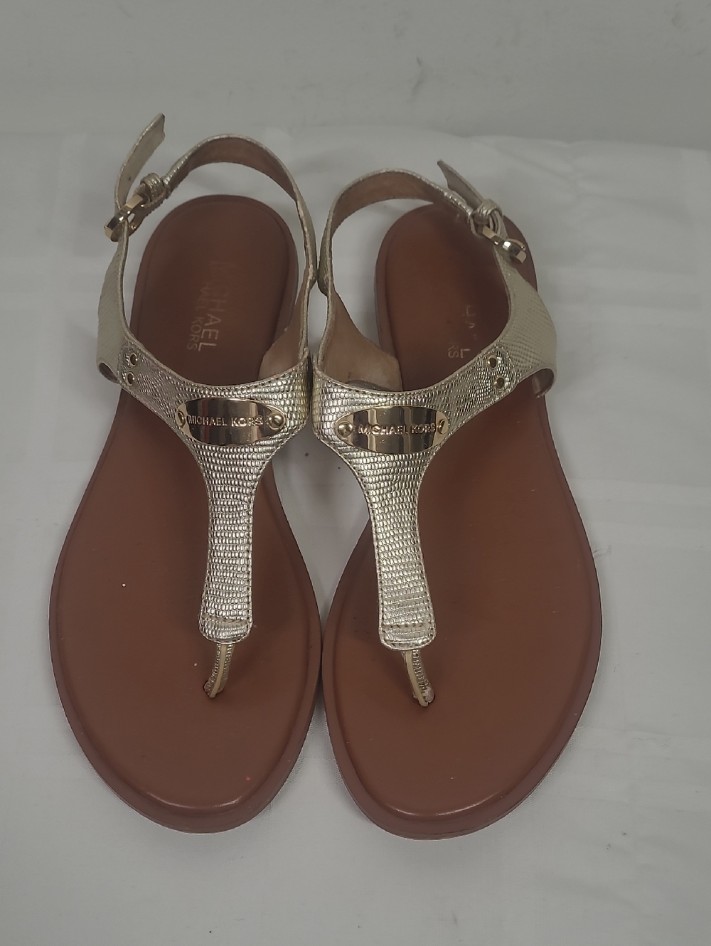 Michael Kors Metallic Gold T-Strap Sandals with Brown Footbed